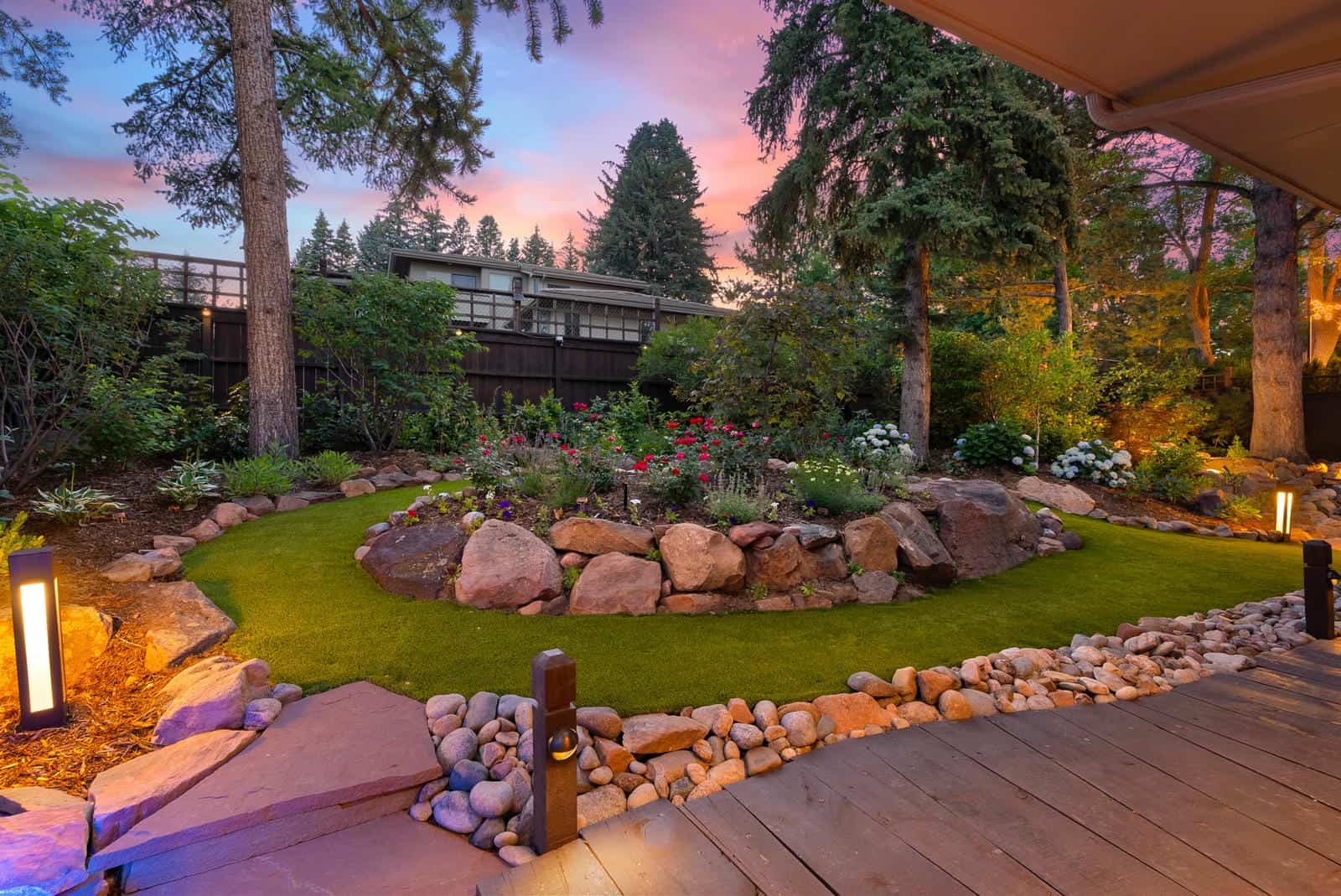 Garden landscape lighting at dusk in Boulder, CO by Nature's Way Landscapes