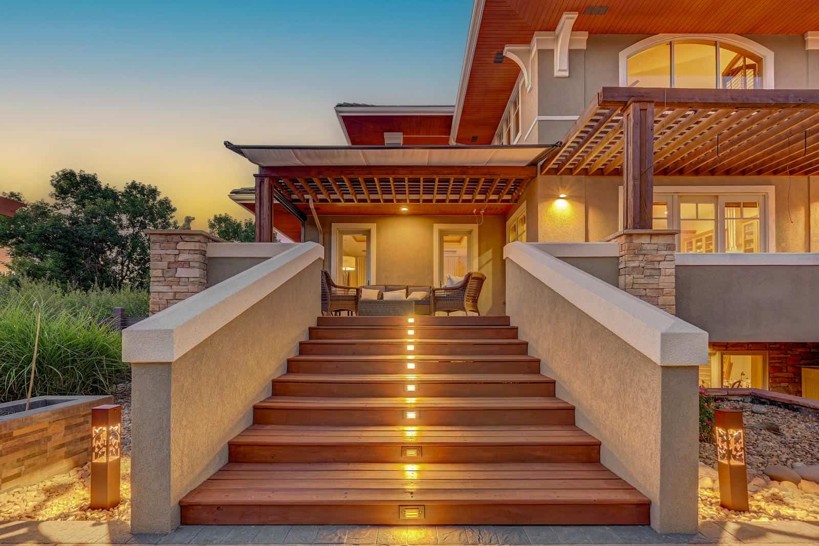 Outdoor staircase with landscape lighting at night in Boulder, CO by Nature's Way Landscapes