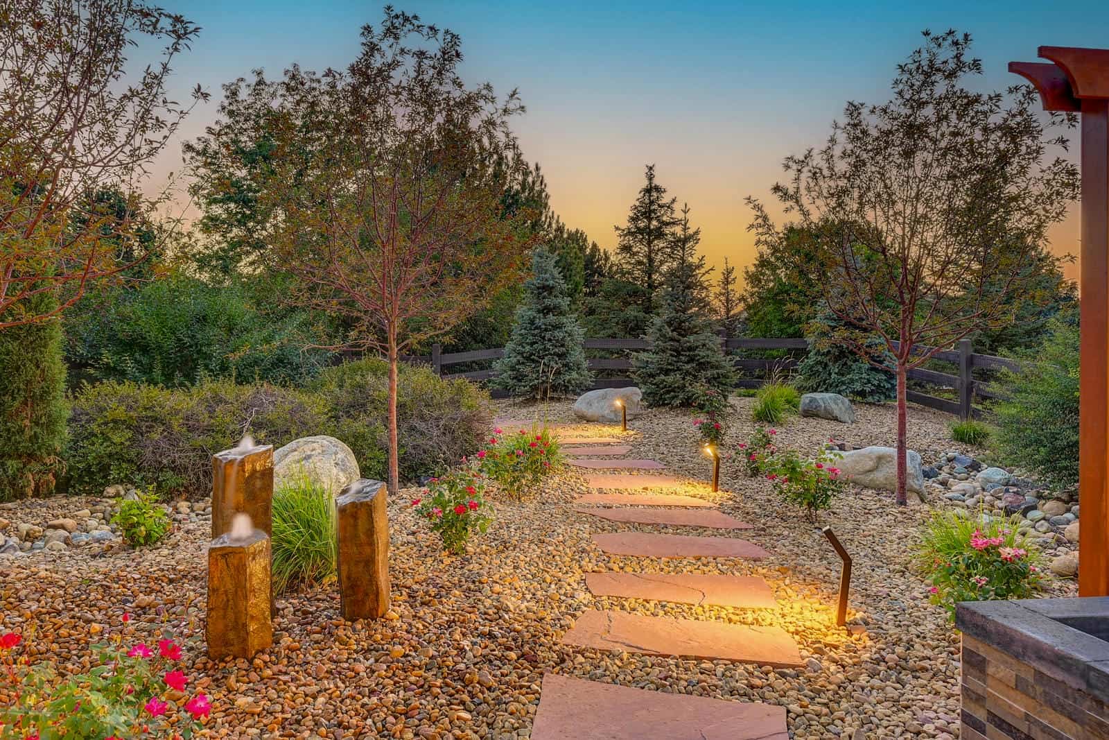 Landscape garden path and planting beds at dusk in Boulder, CO by Nature's Way Landscapes