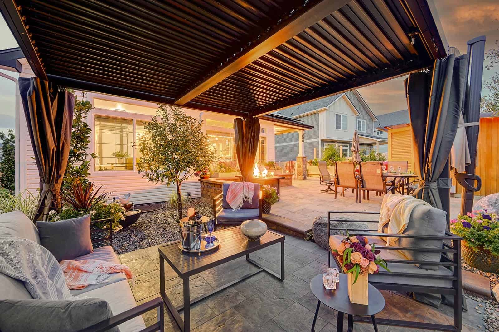 Pergola and outdoor seating area at evening in Broomfield, CO by Nature's Way Landscapes