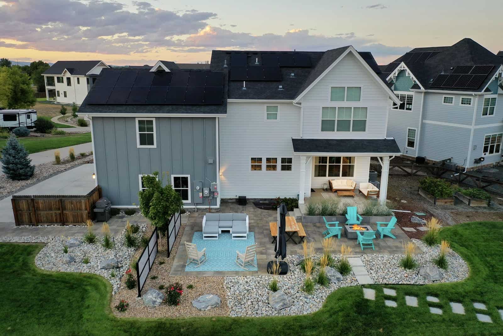 Aerial view of backyard patio and landscape installation at dusk in Erie, CO by Nature's Way Landscapes