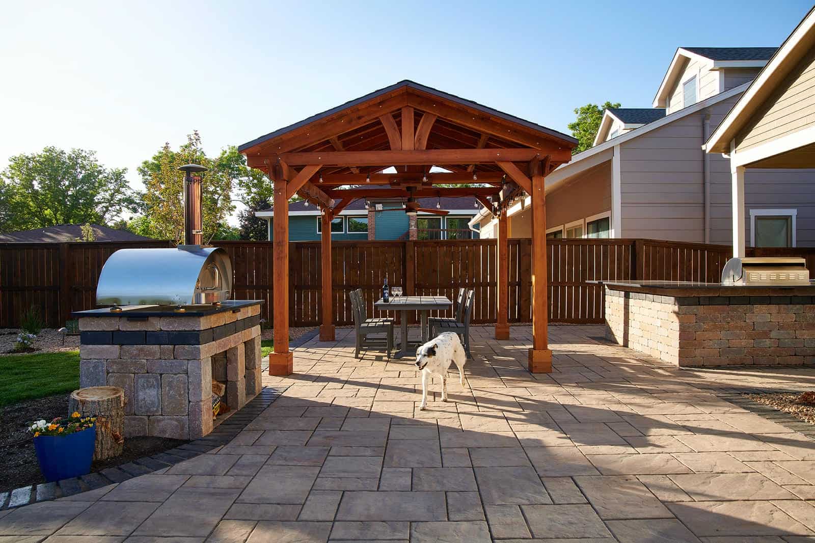 Custom pergola and outdoor kitchen installation in Lafayette, CO by Nature's Way Landscapes