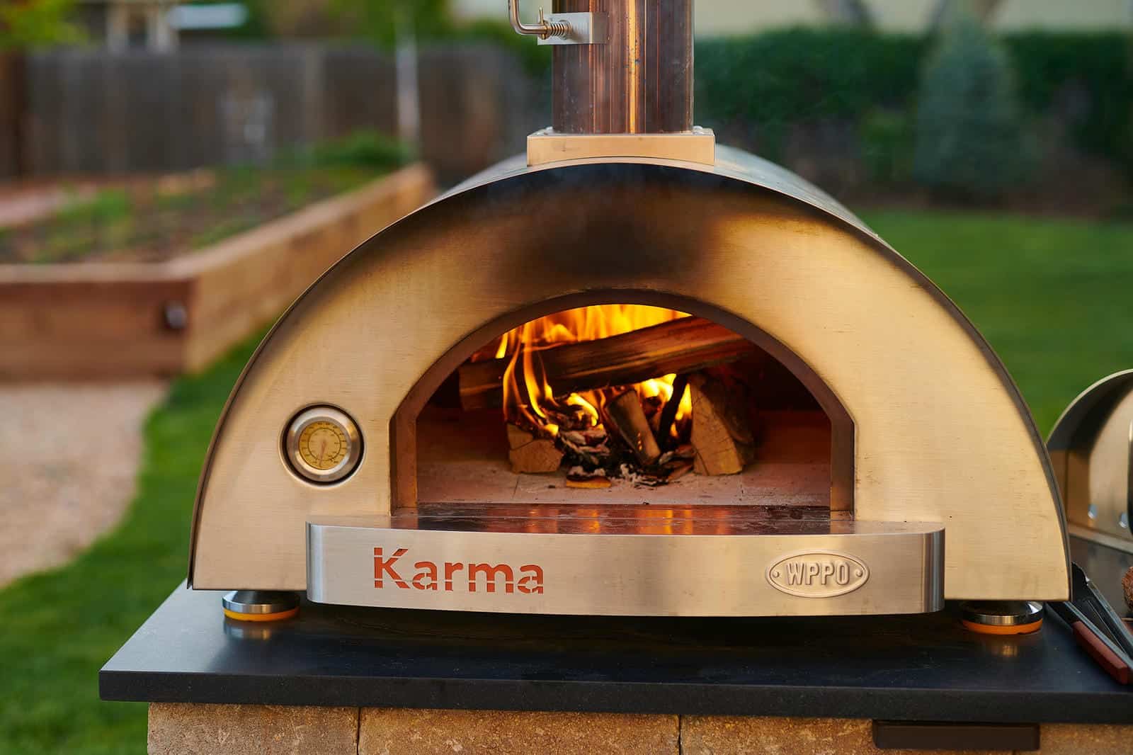 Outdoor pizza oven and pergola patio installation in Lafayette, CO by Nature's Way Landscapes