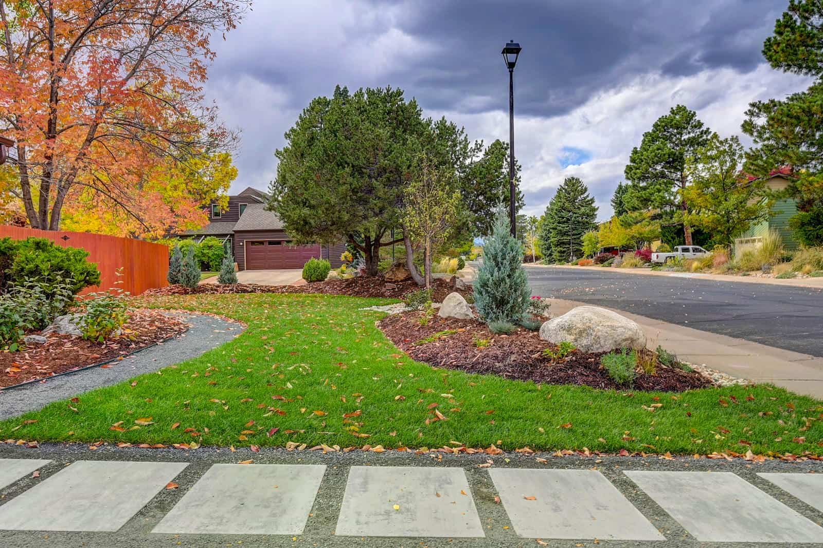 Front yard landscape design with stepping stones and fall color in Louisville, CO by Nature's Way Landscapes