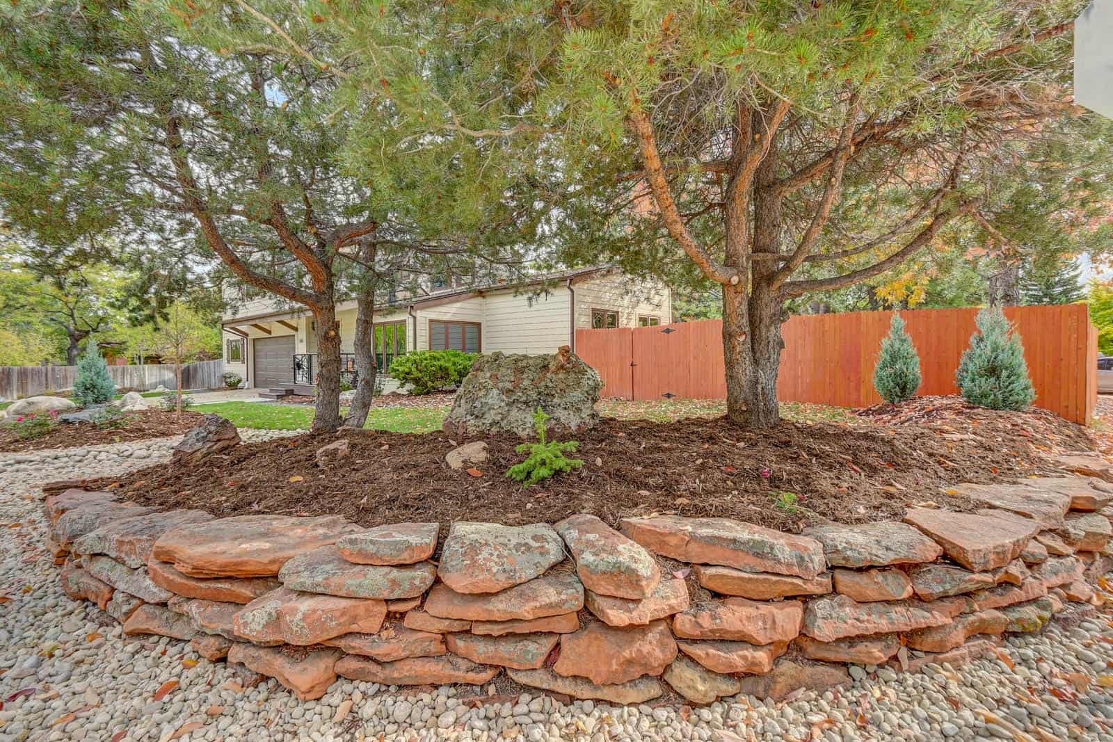 Stone retaining wall and landscape installation in Louisville, CO by Nature's Way Landscapes