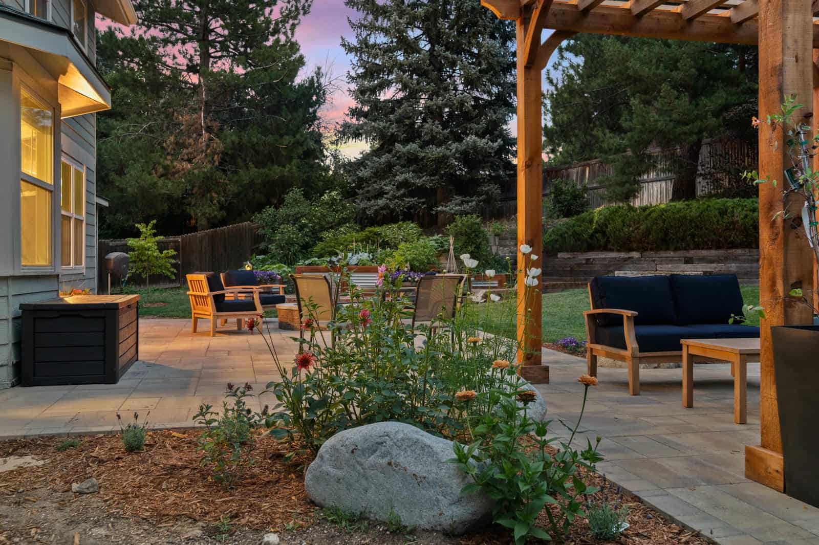 Pergola with outdoor lighting at night — landscape installation in Westminster, CO