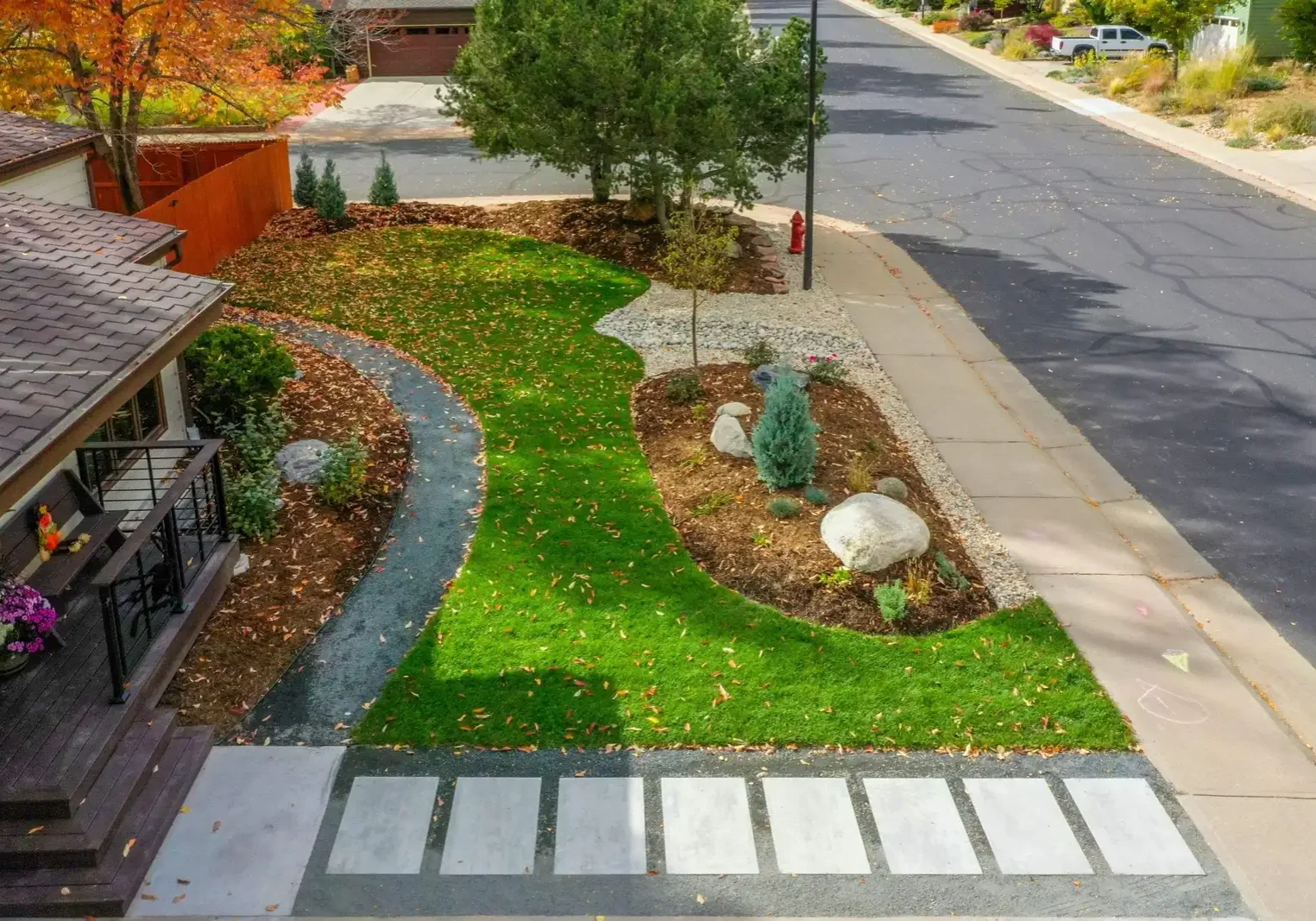 Drought tolerant residential landscape in Boulder CO with native plants and stone walkway